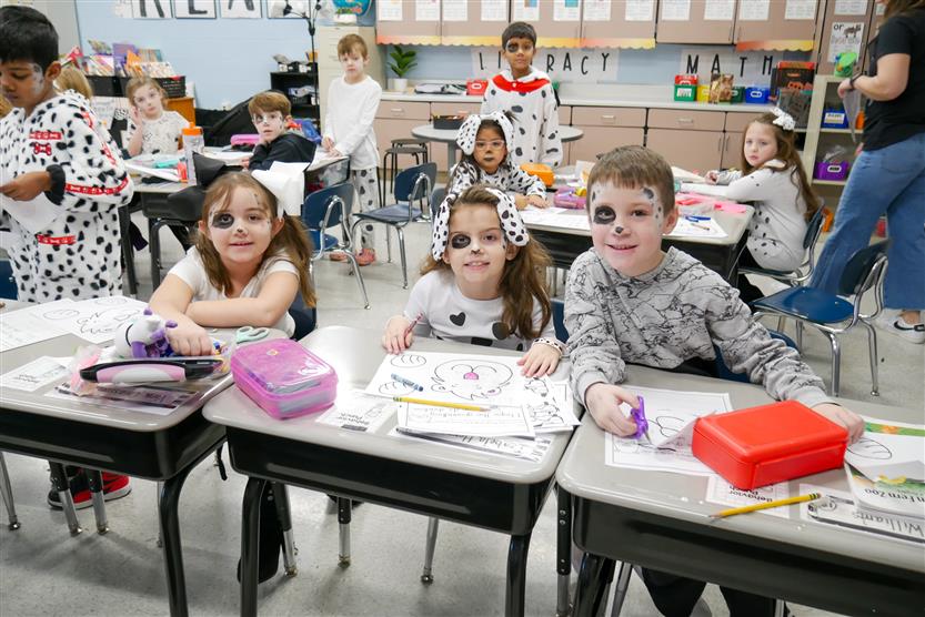 students dressed as dalmatians at desks